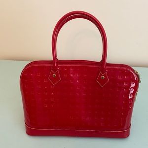 Red patent handbag